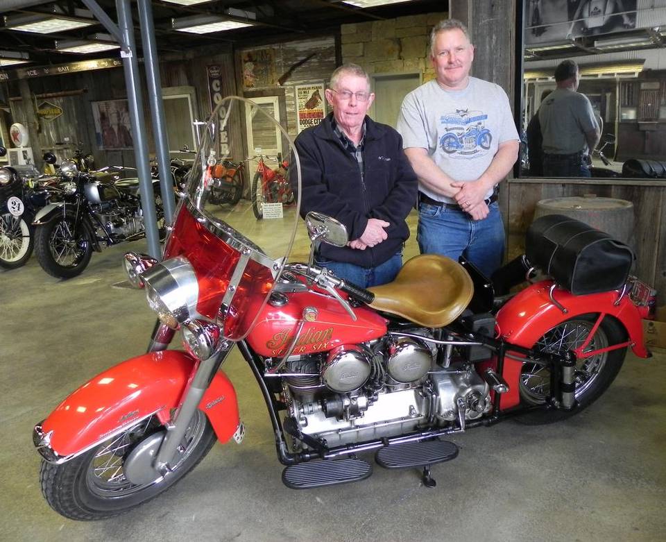 Museum owner Kelly Modlin with a restored Indian motorcycle