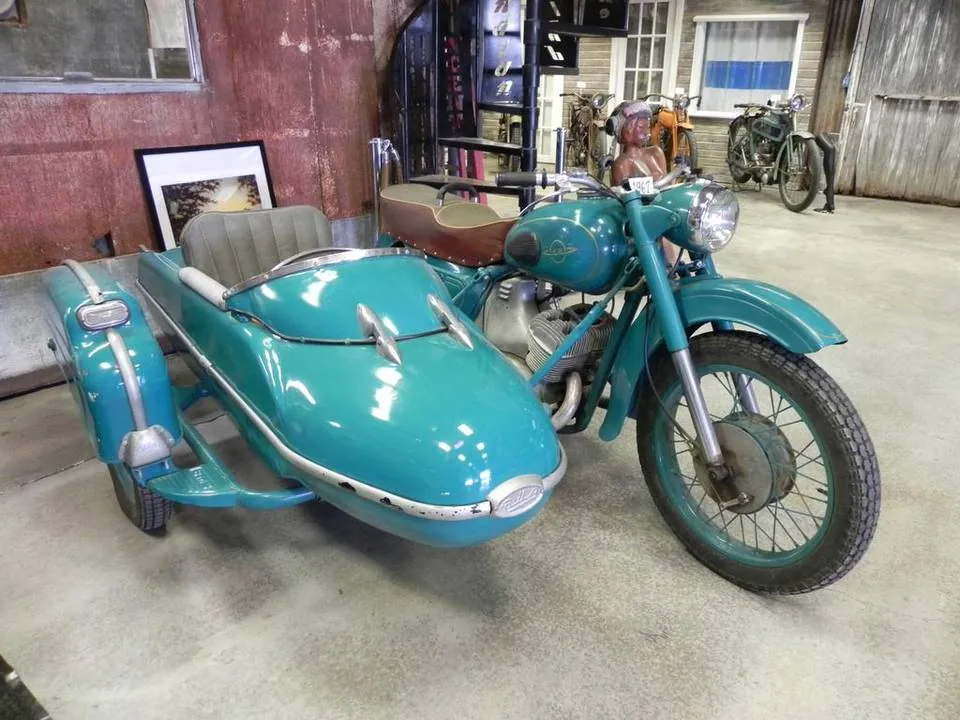 Turquoise Russian Izh motorcycle with sidecar